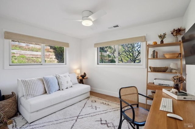 home office with ceiling fan and wood-type flooring