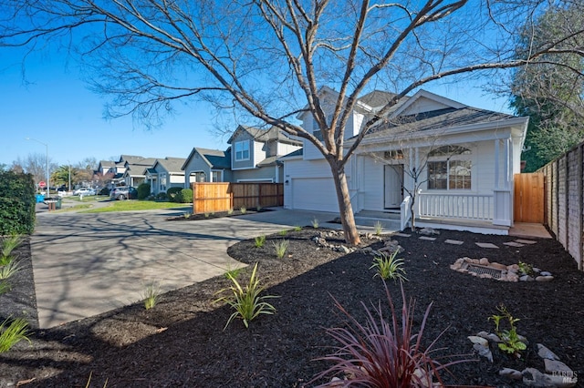 view of front facade featuring a garage and covered porch