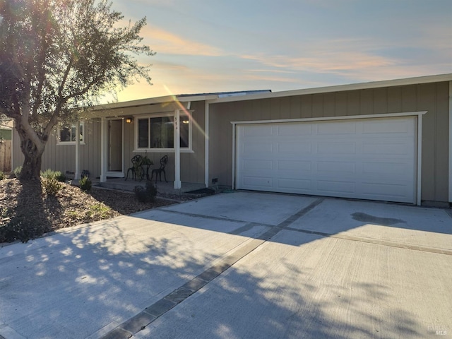 single story home featuring driveway and an attached garage