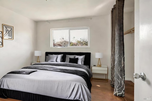 bedroom featuring wood finished floors