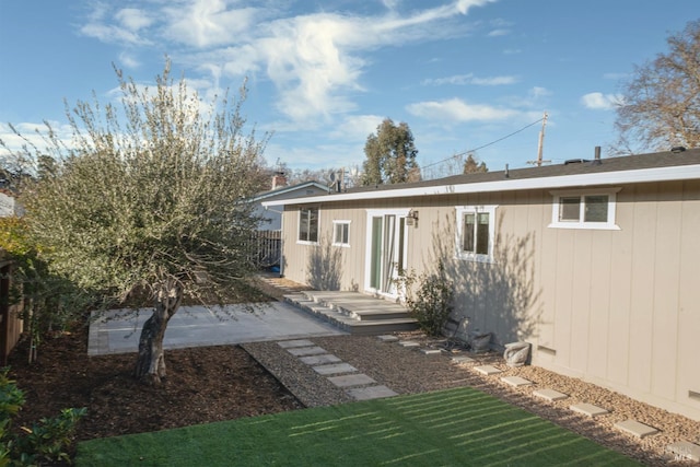 back of house featuring fence