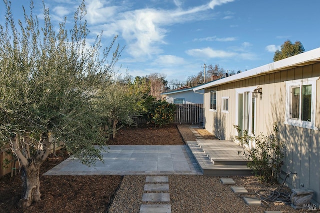 view of yard featuring a patio area and fence