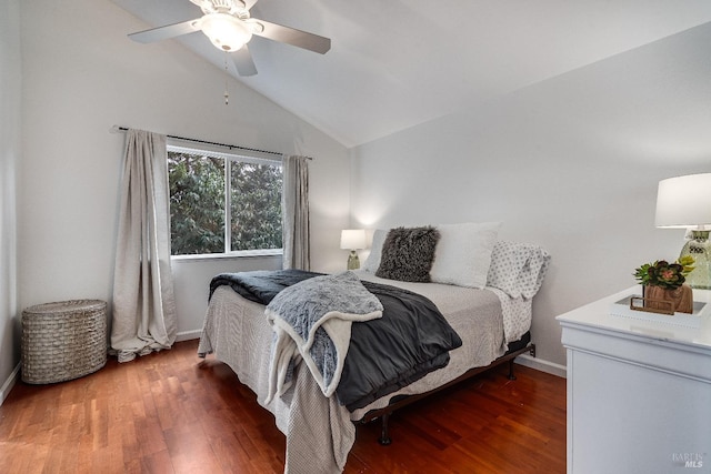 bedroom featuring lofted ceiling, dark wood-type flooring, and ceiling fan