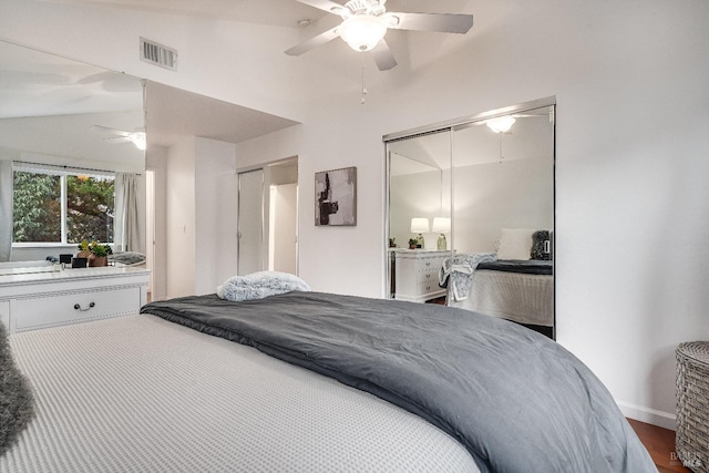 bedroom with wood-type flooring, lofted ceiling, ceiling fan, and a closet