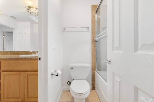 full bathroom with enclosed tub / shower combo, vanity, tile patterned floors, and toilet