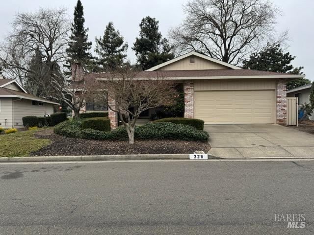 single story home featuring a garage