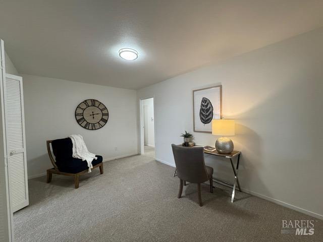 office area with light colored carpet