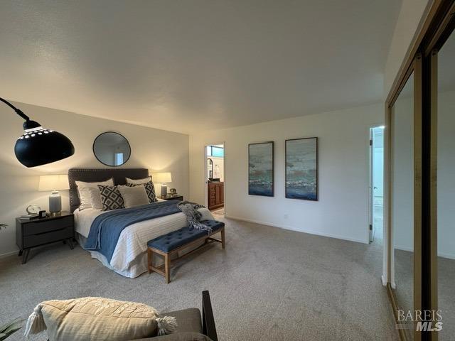 bedroom with light colored carpet