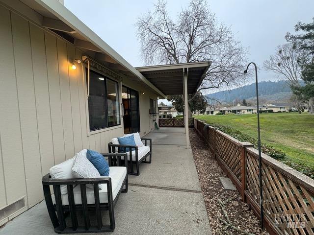 view of patio / terrace featuring a mountain view