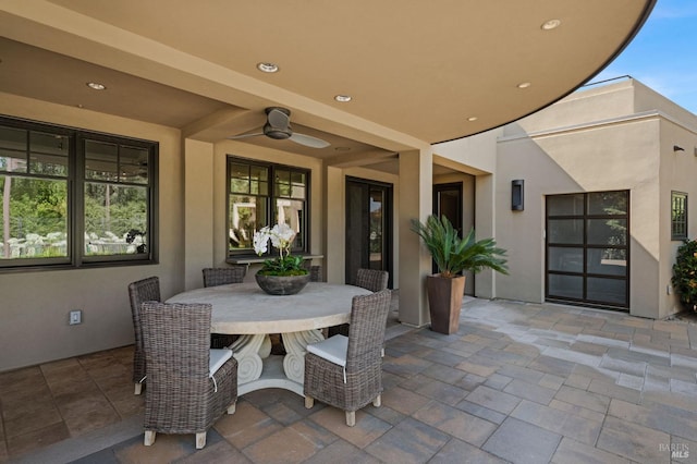 view of patio featuring ceiling fan