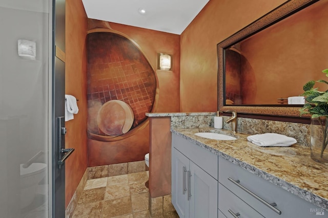 bathroom with vanity and toilet