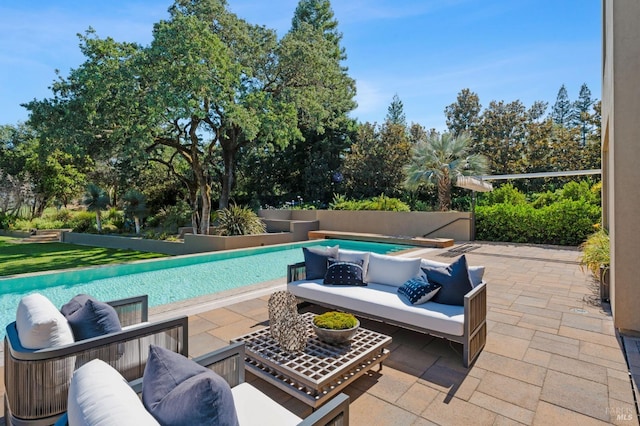 view of swimming pool with a patio area and outdoor lounge area