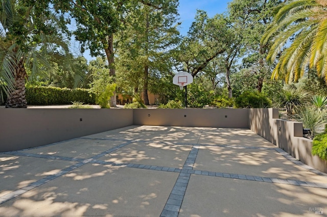 view of patio with basketball hoop