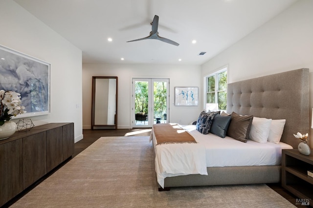 bedroom with dark hardwood / wood-style flooring, access to outside, and ceiling fan