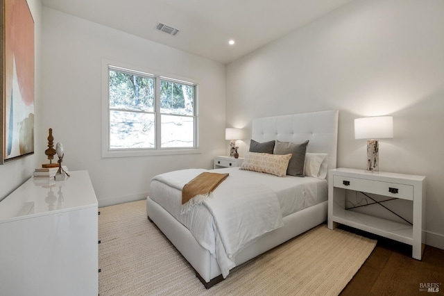 bedroom featuring wood-type flooring