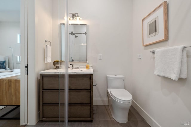 bathroom with vanity, toilet, and wood-type flooring