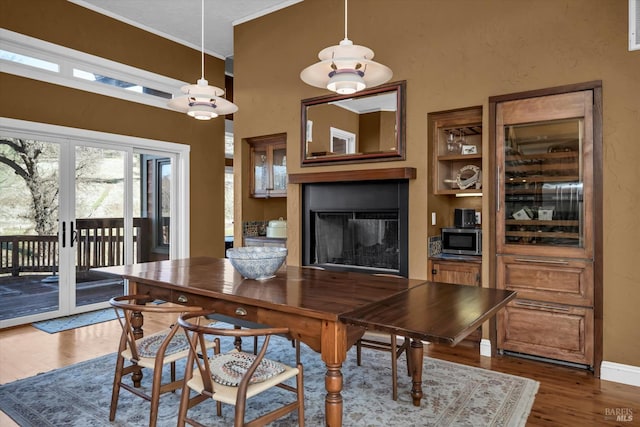 dining area with french doors and dark hardwood / wood-style floors