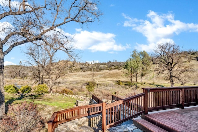 wooden terrace with a rural view