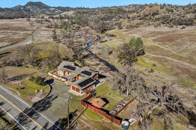 aerial view with a mountain view and a rural view