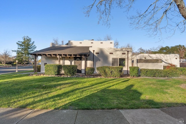 view of front of property with a front yard