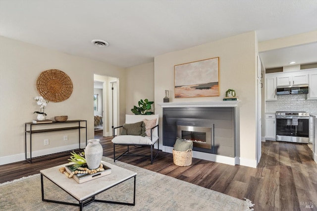 living room featuring dark wood-type flooring