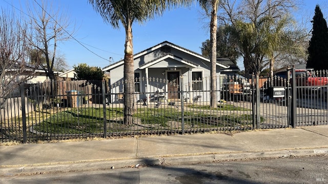 bungalow-style house with a front lawn