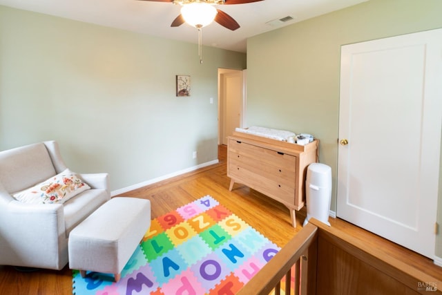 bedroom with ceiling fan and light wood-type flooring