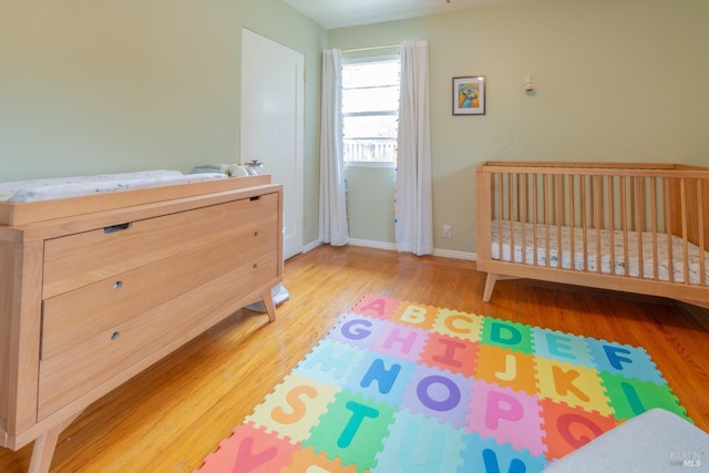 bedroom with wood-type flooring