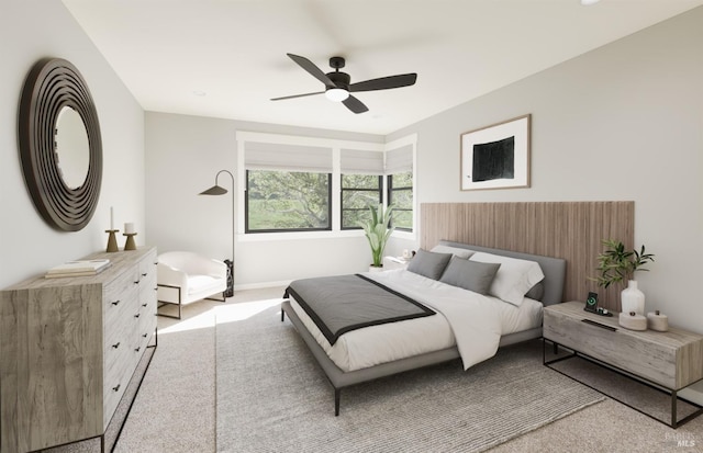 bedroom with light carpet and ceiling fan