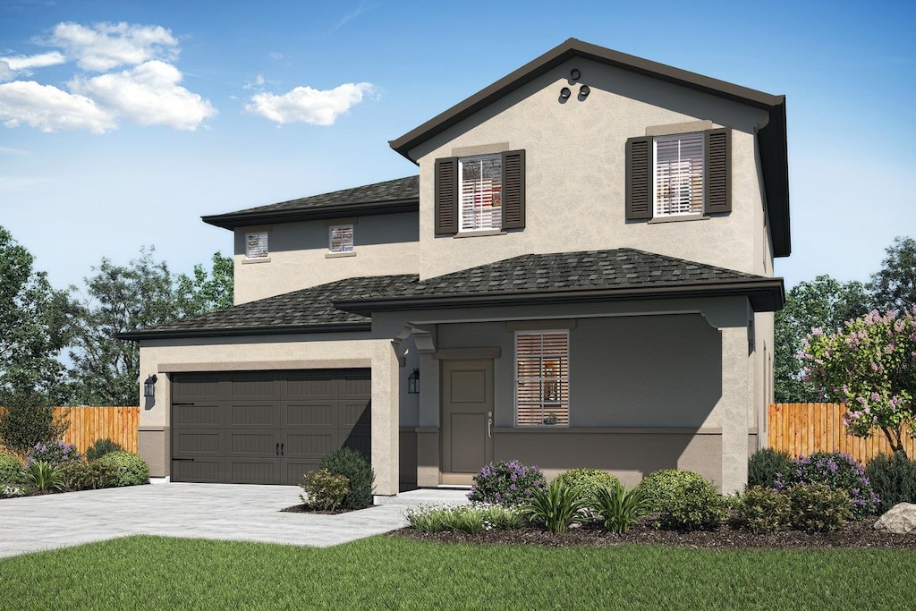 traditional home with stucco siding, a shingled roof, driveway, and fence