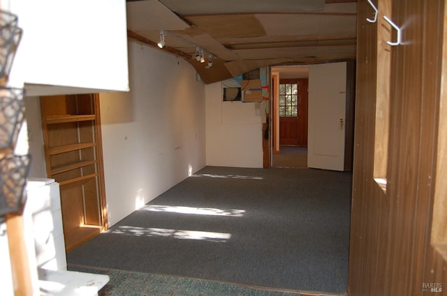 unfurnished room featuring carpet