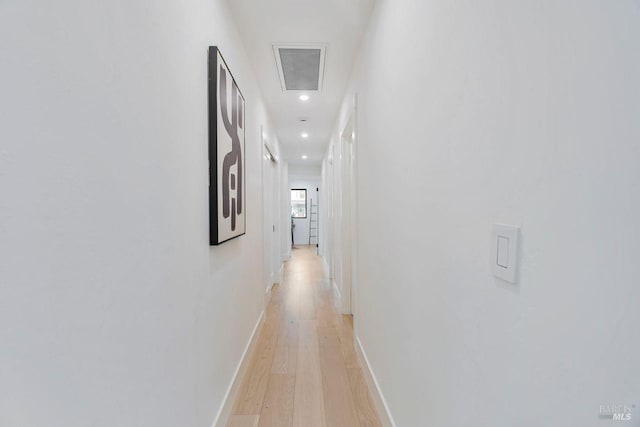 hallway with light wood-type flooring