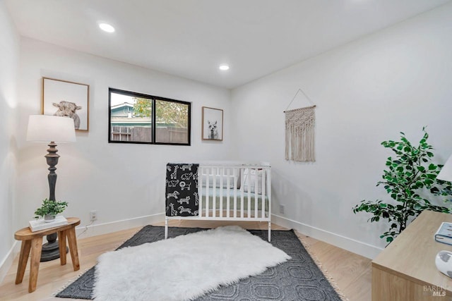 bedroom with light wood-type flooring