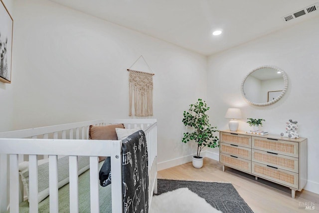 bedroom with wood-type flooring