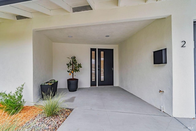 property entrance with a patio area