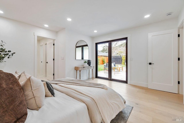 bedroom with access to outside and light hardwood / wood-style floors