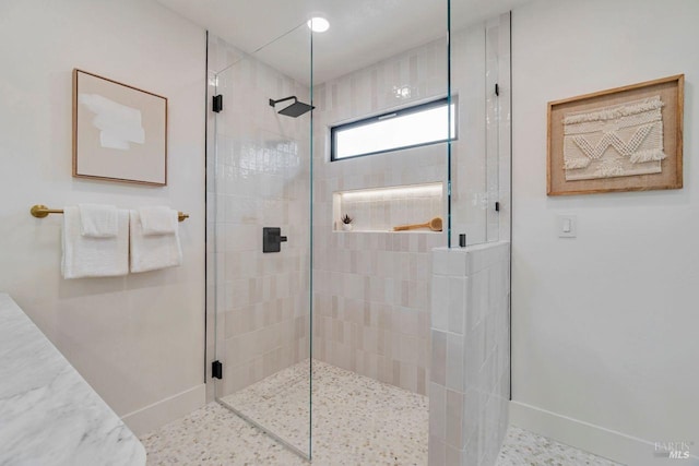 bathroom with a shower with shower door