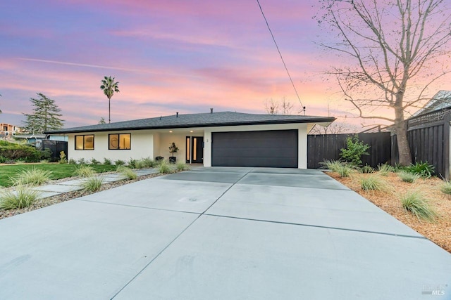 ranch-style home with a garage