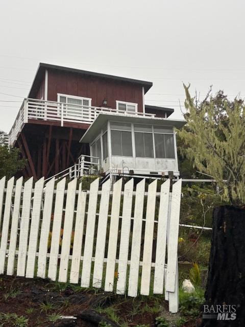 view of front facade featuring a sunroom