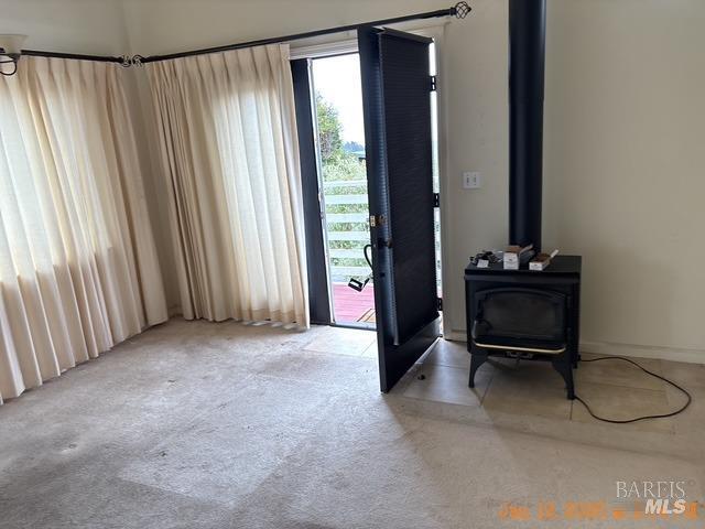 view of carpeted foyer entrance