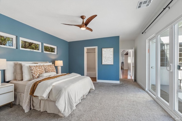 carpeted bedroom with access to outside and ceiling fan