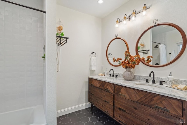 bathroom featuring tile patterned flooring and vanity