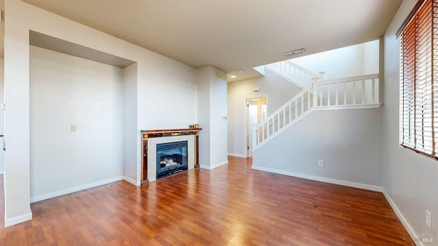 unfurnished living room with hardwood / wood-style floors