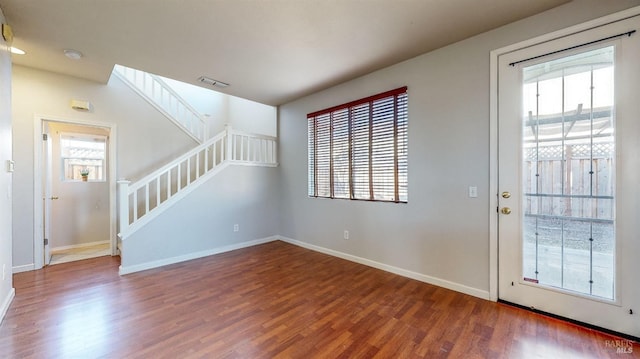 entrance foyer featuring a healthy amount of sunlight and wood-type flooring