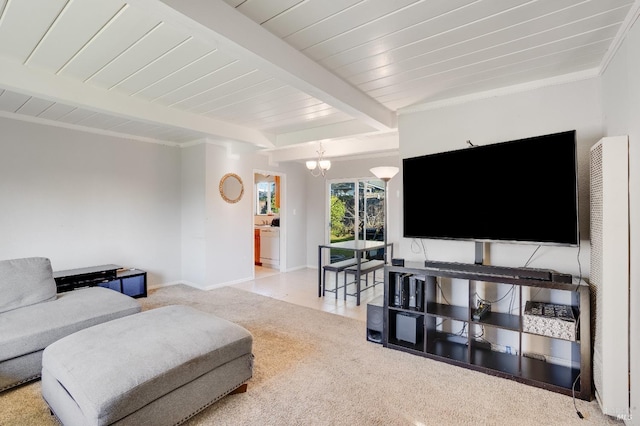 carpeted living room featuring a notable chandelier and beam ceiling