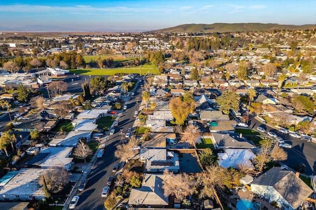 birds eye view of property with a mountain view