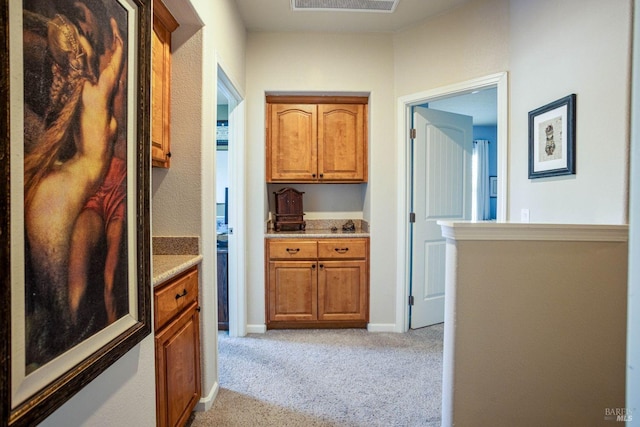 hallway with light carpet