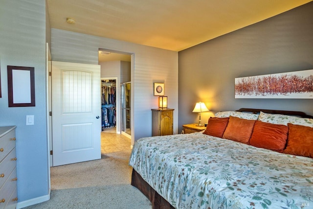 bedroom featuring a walk in closet and a closet