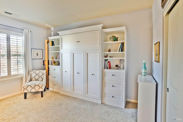 sitting room with light colored carpet