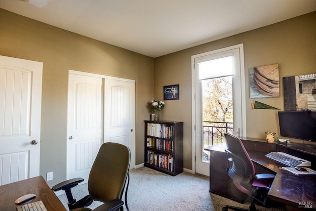 office area featuring light colored carpet